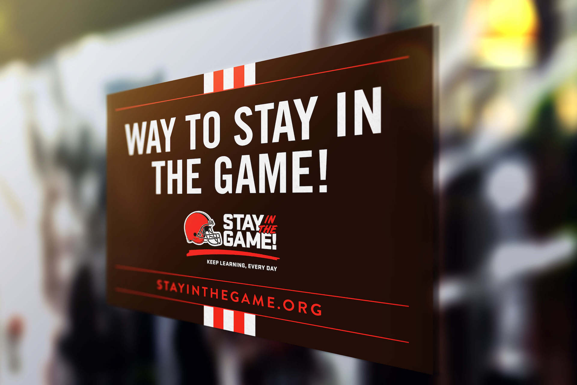 Stay in the Game storefront sign on a window